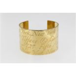 A Tiffany 18ct yellow gold Cuff Notes bangle, marked '© TIFFANY & CO. 750', the wide, flat bangle