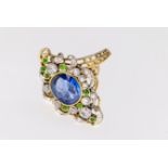 An 18ct gold, sapphire, diamond and emerald navette ring, in the Belle Epoque style of bicoloured