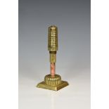 Trench Art - A WWI French Beehive fuse on stand, the polished fuse with pierced holes numbering 1-