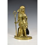 Charles Dickens - A novelty figural brass fireside companion set, stamped to reverse 'Mr Micawber