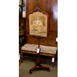 A William IV mahogany pole screen, with a needlepoint panel of a woman and child, on a hexagonal