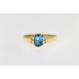 An 18ct yellow gold, aquamarine and diamond ring, the oval cut aquamarine measuring approximately