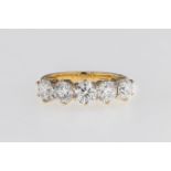 A 18ct yellow gold and diamond 5 stone ring, featuring a row of 5 brilliant cut diamonds totalling