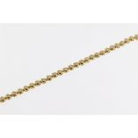 An 18ct yellow gold and diamond bracelet, featuring brilliant cut diamonds in bubble rub over