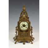 A French cast and pierced brass mantel clock, late 19th century, the Renaissance style case with