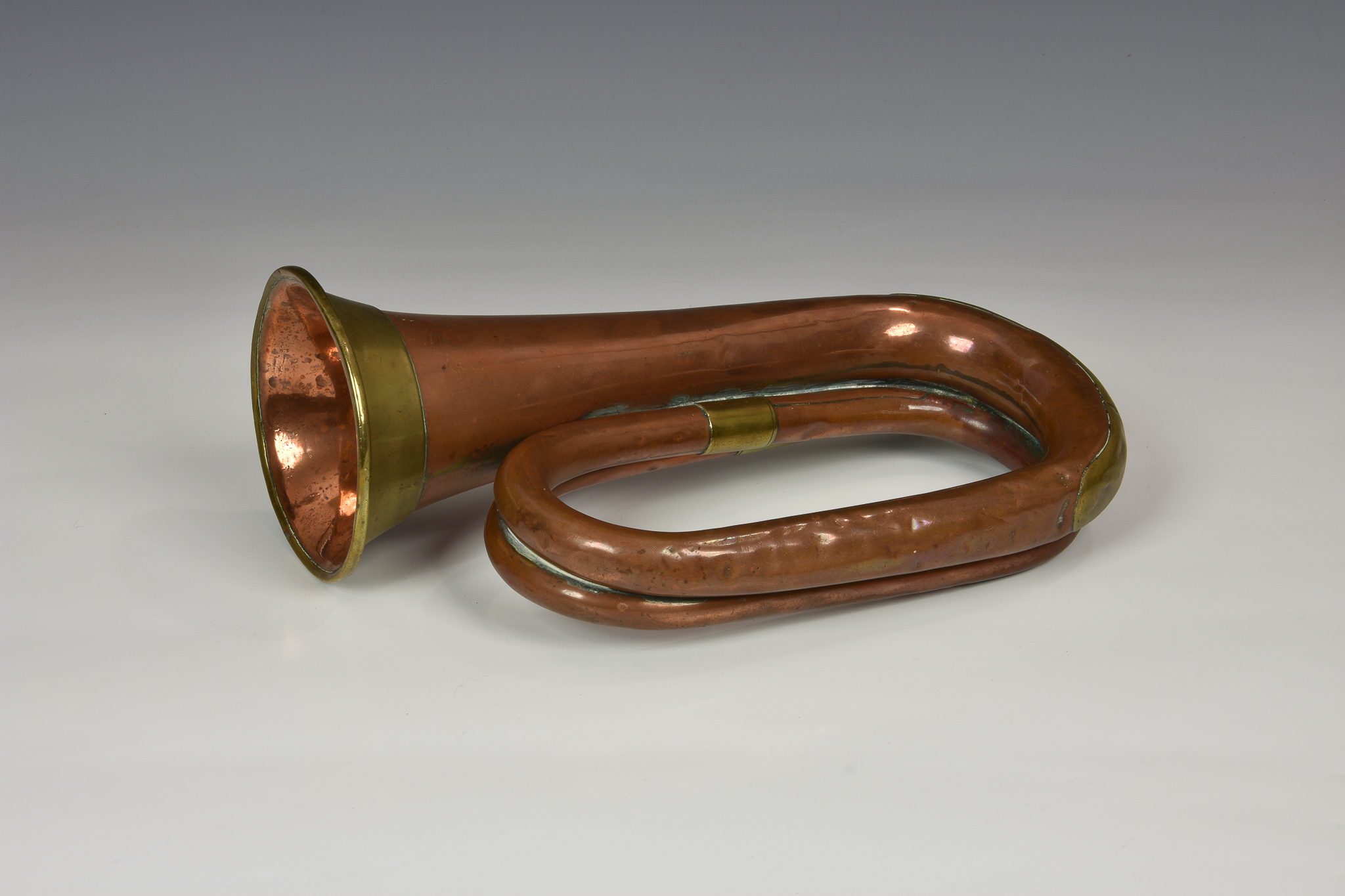 A 1916 WWI military issue USA cavalry copper & brass bugle by J W York & Sons, of typical form, - Image 2 of 3