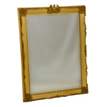 A Victorian gilt and composition mirror, the rectangular plate within a swept frame with later Royal