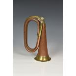 A 1916 WWI military issue USA cavalry copper & brass bugle by J W York & Sons, of typical form,