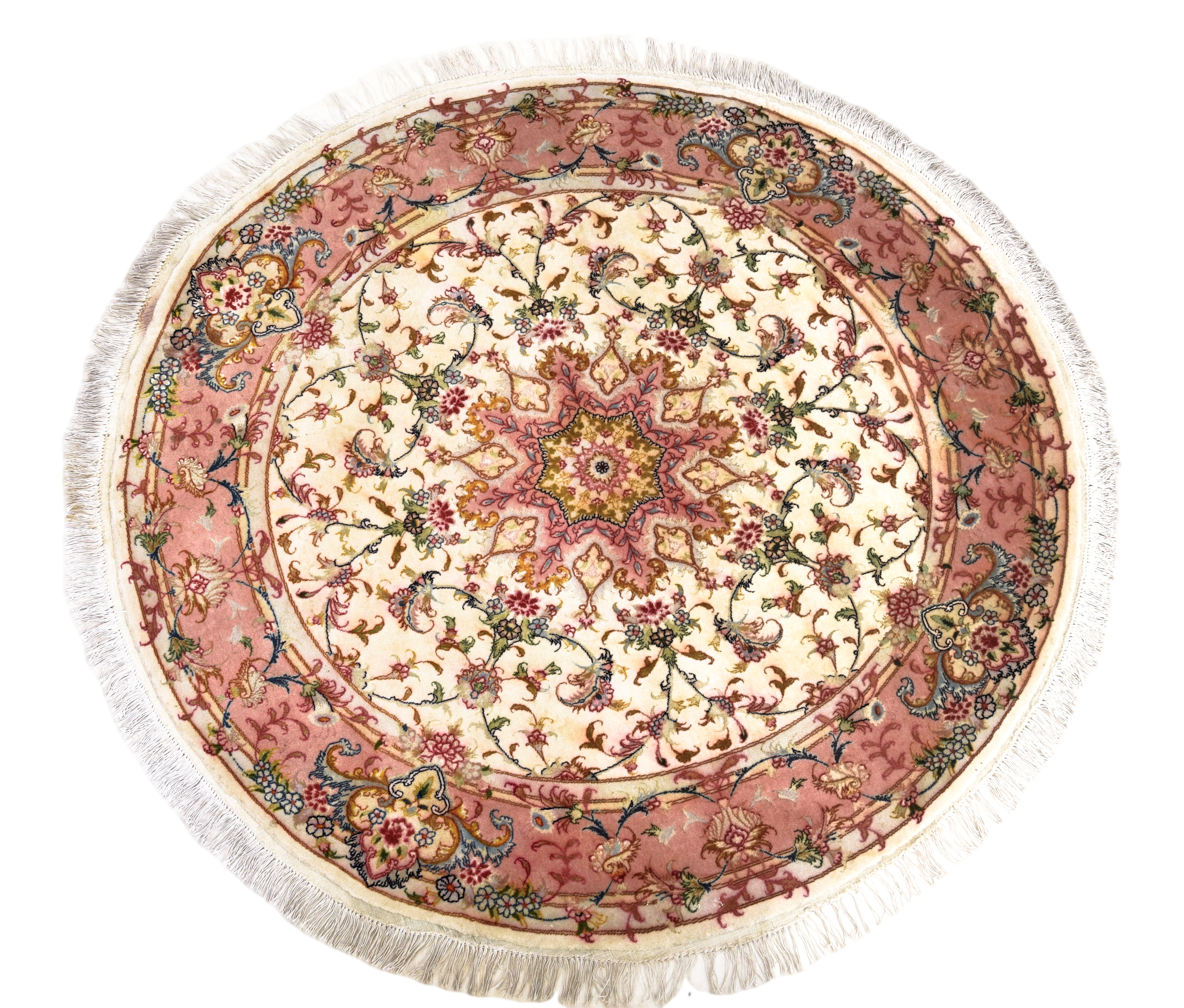 A Tabriz circular part-silk rug, late 20th century, the central eight point medallion on an ivory