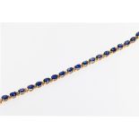 An 18ct rose gold and sapphire bracelet, featuring oval cut sapphires totalling approximately 16.