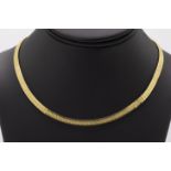 An 18ct gold necklace articulated segment necklace, with fluid brushed gold detailing to the