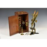 An early 20th century binocular microscope by Henry Crouch of London, numbered 176, the lacquered