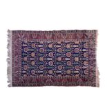 A Caucasian rug, second half 20th century, the dark blue field with all over decoration of