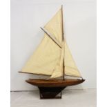 An impressive large early 20th century wooden pond yacht, with weighted keel, complete with masts,
