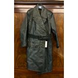 A WW2 German dispatch riders green leather coat, with attached leather belt, tartan lining,