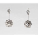 A pair of Edwardian diamond cluster earrings, featuring a combination of old mine cut, old