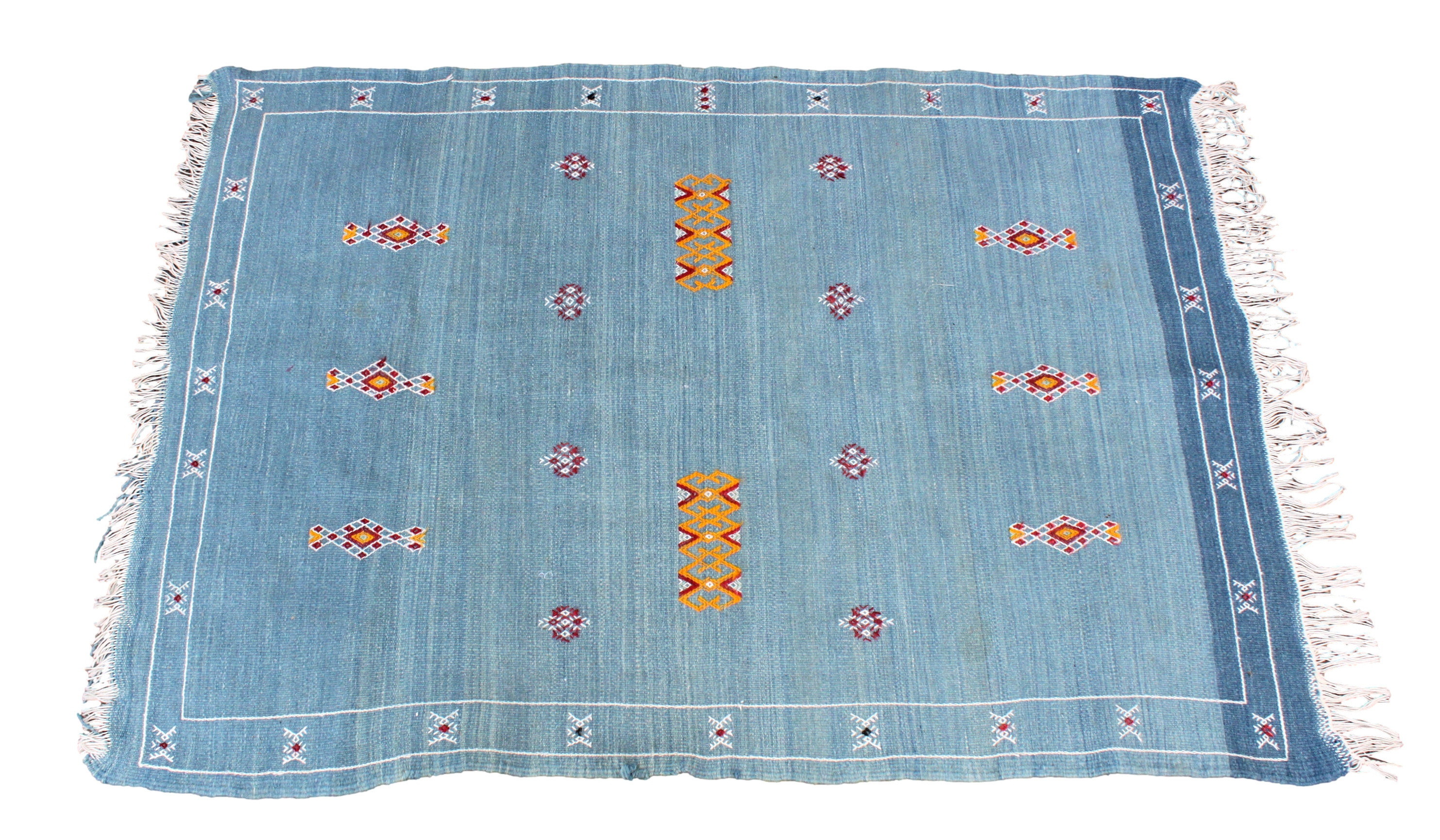 A Moroccan kilim rug, late 20th century, with small geometric motifs on a light blue ground, 56½ x