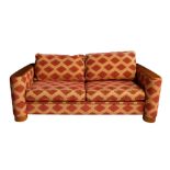 An Art Deco style three seater sofa bed, modern, the low, rectangular back over flared arms capped