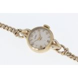 A ladies Tissot 9ct gold manual wrist watch, the Dennison case hallmarked Birm. 1954, signed 15