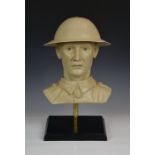 A bespoke plaster bust of a British Army soldier, wearing an original painted British Army brodie,