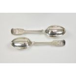 A pair of Channel Islands silver bright cut fiddle pattern table spoons, overstruck Charles T