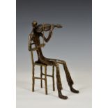 A modern bronze violinist sculpture, unmarked, depicting a seated gentleman, 10in. (25.4cm.) high. *