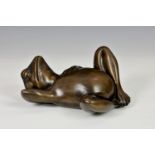 A modern cold cast bronze frog, of comical form in a relaxed recumbent pose, 9¼in. (23.5cm.) long,