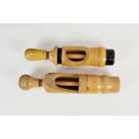 Two 19th century turned wooden wine bottle corkers, probably French, of similar design, the