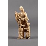 A Japanese carved ivory okimono of a rose seller, Meiji period (1868-1912), the man standing with
