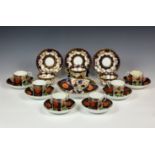 A Coalport porcelain part coffee service, early 19th century, painted in the Imari 'crab claw'