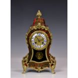 A French boulle work and gilt metal mantel clock, 19th century, the gilt metal dial with inset