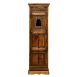 A carved hardwood and metal banded Indian corner cupboard, the flared top over a faux cupboard