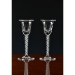 A pair of 18th century style airtwist wine glasses, 20th century, the bell bowls with basal