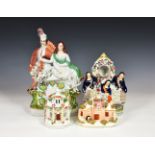 A small group of Staffordshire flat back pottery, 19th century, to include a clock figure group