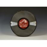 A vintage enamel "His Master's Voice" RECORDS advertising sign, in the form of a 78 shellac