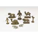 A collection of miniature brass figures, comprising a lion; camels; a horse and human figures;