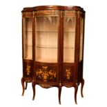 A pair of Louis XV style kingwood, beechwood, marquetry and gilt metal serpentine vitrines, Spanish,