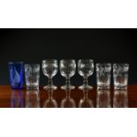 A collection of 19th century drinking glasses, including a set of three Victorian wine glasses