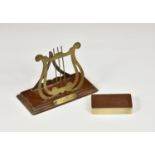 A novelty brass and wood letter rack fashioned as a lyre, inscribed plaque to rectangular oak