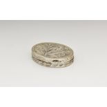 A Continental silver patch box, 19th / early 20th century, oval with chased foliate decoration and