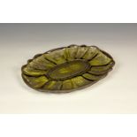 A silver flashed yellow glass tray, early 20th century, oval with shaped rim, with foliate and