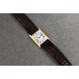 A ladies Cartier 18ct yellow gold Tank Quartz wristwatch, no. 8810528632, 1990s, silvered dial