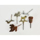 A collection of novelty canine related corkscrews, to include Wire-Haired Terrier brass corkscrew;