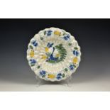 A Continental faience dish, probably 19th century, blue single letter mark to base, of scalloped