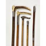 Five antique and vintage riding crops, in varying materials, to include Zair and H. Andrews stag