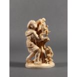 A Japanese carved ivory okimono, Meiji period (1868-1912), of a man standing beside a fruit-