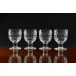 A set of four late-Georgian cut glass rummers, the deep, cupped bowls with printie, diamond and