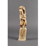 A Japanese carved ivory okimono of a boatman, Meiji period (1868-1912), standing holding before