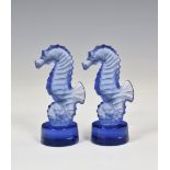 Two Lalique Seahorse paperweights, 2001, polished blue glass, etched 'Lalique France', complete with