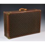 Louis Vuitton - a monogrammed coated canvas and leather hard suitcase, with monogrammed leather
